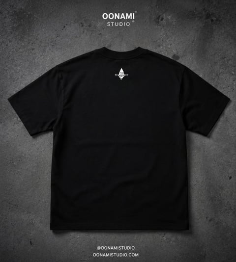Black t-shirt with small white Oonami Studio logo on back, displayed flat on textured gray background