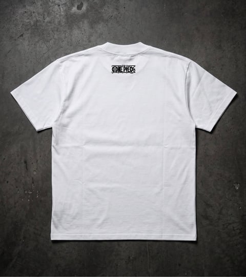 White t-shirt with One Piece logo on back, displayed flat on gray textured background