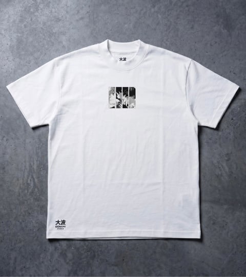 White t-shirt with small black and white photo print on chest and Japanese characters on sleeve, displayed on gray textured background