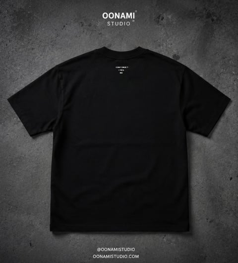Black crewneck t-shirt displayed flat on gray textured background with OONAMI Studio branding