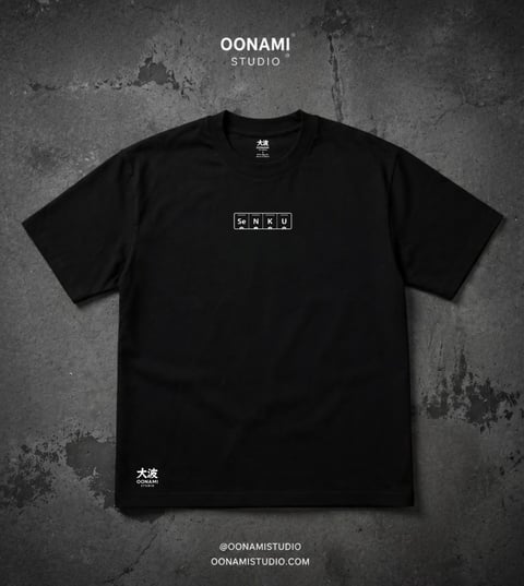 Black t-shirt from Oonami Studio featuring small white graphic print on chest against textured gray background
