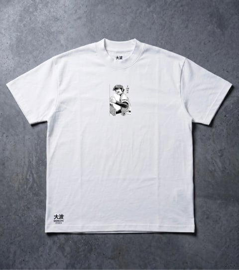 White t-shirt with small black illustration of a figure in traditional Japanese style on chest and text on sleeve, displayed flat against gray background