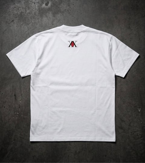 White short-sleeve t-shirt with small red logo on back neck area, laid flat on concrete background