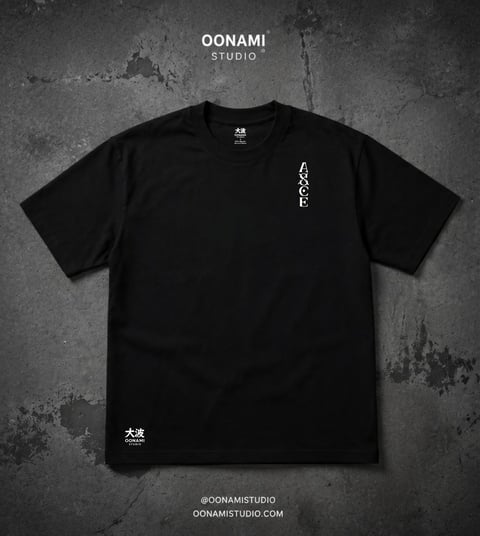 Black t-shirt from Oonami Studio with white vertical text on chest and kanji characters on lower left, displayed on textured gray background
