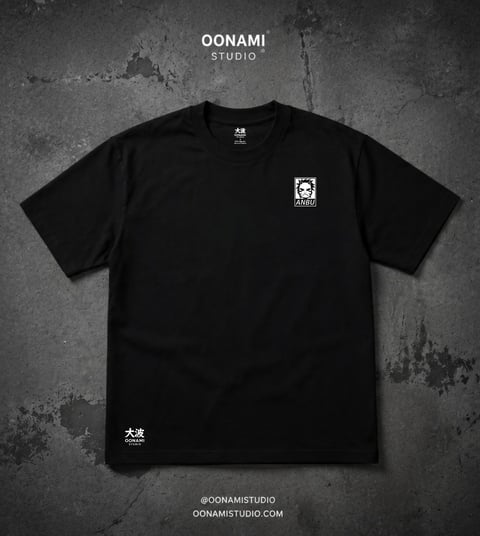 Black t-shirt with white logo on chest and Japanese characters on lower left, displayed flat lay on textured gray background