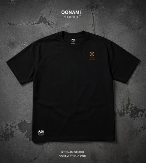 Black t-shirt with small copper compass rose logo on chest and Japanese characters on lower left