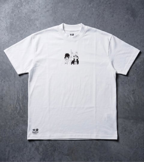 White t-shirt with black minimalist anime character graphics on chest and Japanese text on bottom hem, displayed on gray concrete background