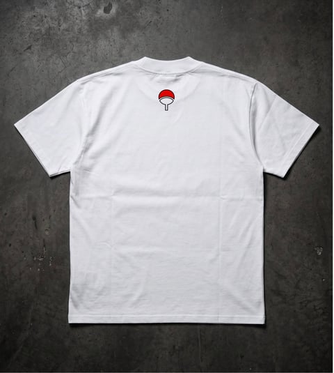 White t-shirt with small red circular logo on back, displayed flat on dark textured background